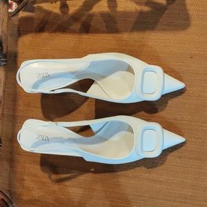 Woman's new beige kitten heels.